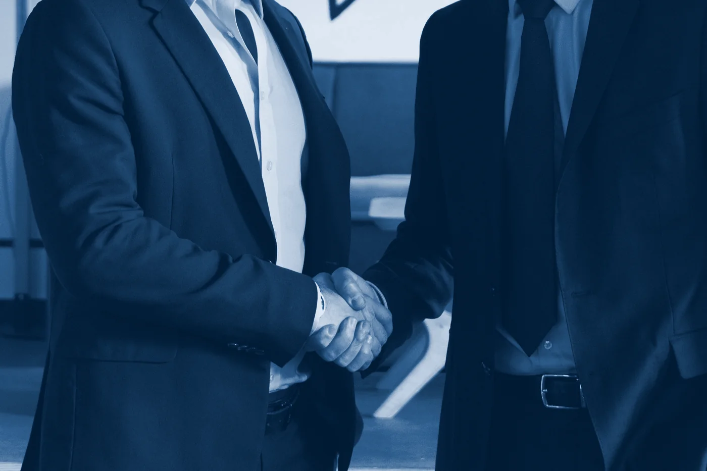 Two executives shaking hands
