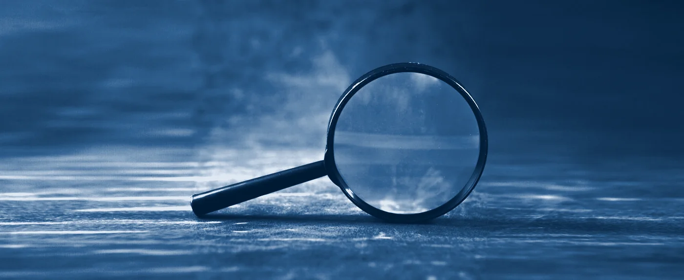 A magnifying glass on a desk